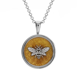 A detailed Silver honey bee pendant surrounded by the resin ashes chamber