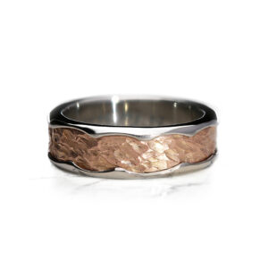 Vulcan Organic wedding ring with polished platinum outer band and hammered rose gold centre