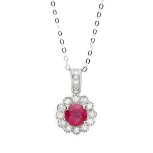 18ct white gold ruby and diamond halo pendant with milgrain detailing on a fine trace chain