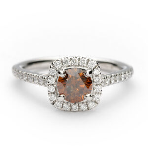 Platinum halo engagement ring with a 0.59ct chocolate orange diamond and cushion-shaped white diamond halo.