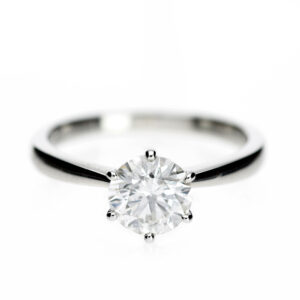 Platinum solitaire engagement ring with a 1.22ct round brilliant diamond in a fluted six-claw setting.