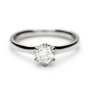 Platinum solitaire engagement ring with a 0.60ct round brilliant diamond in a six-claw setting.