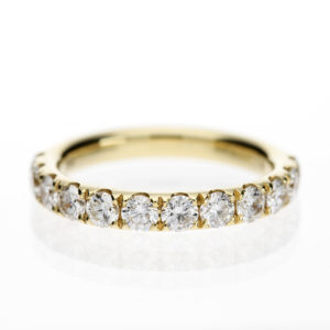 18ct yellow gold diamond band with twelve F/SI round brilliant diamonds totalling 0.94ct in a classic claw setting.