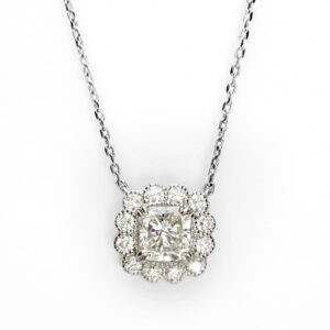 18ct white gold cushion diamond halo pendant with vintage milgrain detailing on a diamond-cut trace chain.